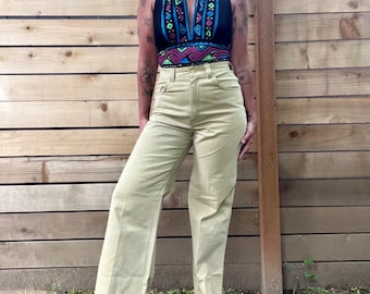 1970’s Denimites flared/bellbottom trouser pants with snail and fish patches on back pockets. Womens size 29