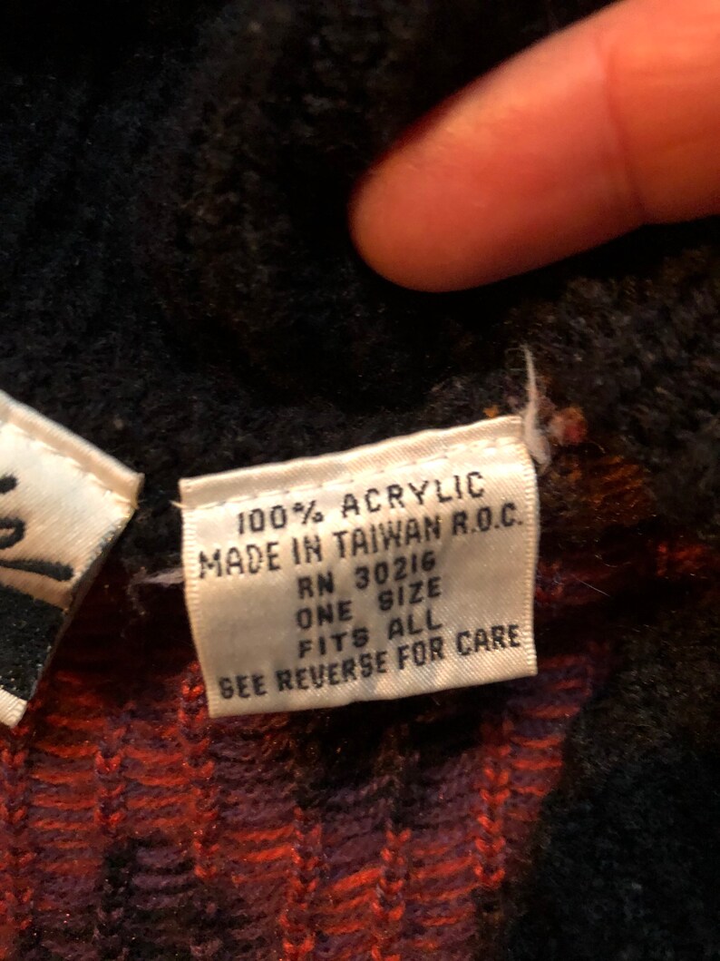 May include: White tag with black text that reads "100% Acrylic Made in Taiwan R.O.C. RN 30216 One Size Fits All See Reverse for Care"