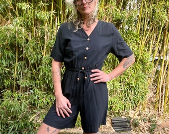 Mono corto negro vintage de los años 80/90 de First Option, talla mediana para mujer.