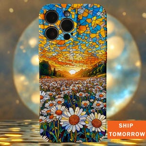 May include: A phone case with a stained-glass effect depicting a daisy field at sunset. The case has a blue, yellow, and orange colour scheme. The text "SHIP TOMORROW" is printed on the bottom right corner.