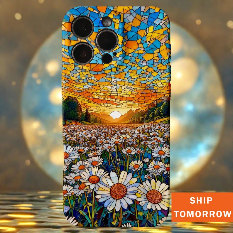 May include: A phone case with a stained-glass effect depicting a daisy field at sunset. The case has a blue, yellow, and orange colour scheme. The text "SHIP TOMORROW" is printed on the bottom right corner.