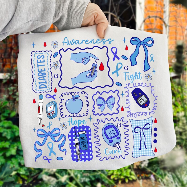 May include: White fabric with blue and red illustrations related to diabetes awareness. The design includes text that says "Awareness", "Diabetes", "Fight", "Hope", and "Cure". There are also images of a blood glucose meter, insulin syringe, and a blue ribbon.