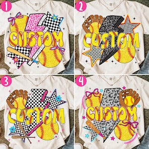 May include: Cream-colored t-shirts with softball-themed designs. Each shirt features the word "CUSTOM" in yellow, along with softballs, bats, gloves, and star accents. Designs include checkered, leopard, and floral patterns.