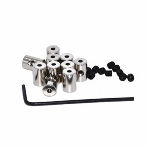 May include: A set of silver metal cable connectors with a black allen wrench. The connectors are round and have a small hole in the center.