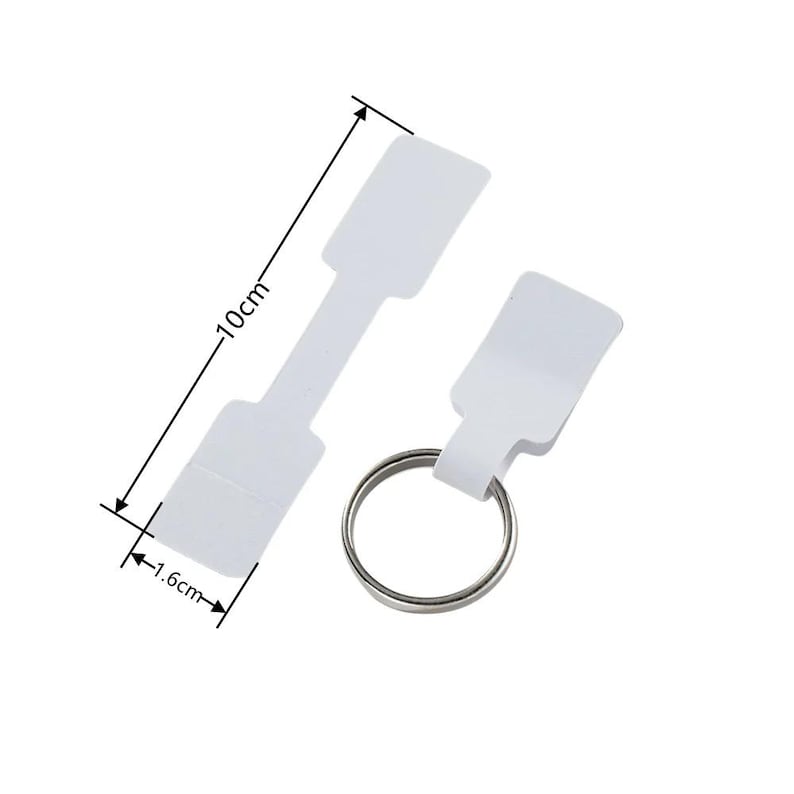 May include: Two white paper tags with a metal ring. The larger tag is 10 cm long and 1.6 cm wide. The smaller tag is 1.6 cm wide.