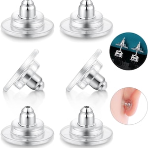 May include: Six clear plastic earring backs with a silver metal post and a round top. The earring backs are designed to help keep earrings in place.