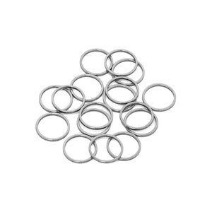 May include: A pile of silver jump rings, a type of jewelry finding used for connecting chains, cords, and other jewelry components.