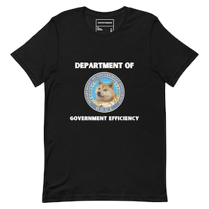 May include: Black t-shirt with a white graphic of a Doge meme with the text "Department of Government Efficiency" and a seal that says "Department of Government Efficiency D.O.G.E."
