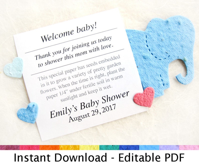 K&ouml;nnte beinhalten: Eine wei&szlig;e Karte mit blauen und rosa Papierherzen und einem blauen Papier-Elefanten. Die Karte sagt "Willkommen Baby!" und "Emilys Baby Shower 29. August 2017". Die Karte sagt auch "Dieses besondere Papier enth&auml;lt eingebettete Samen, aus denen eine Vielzahl h&uuml;bscher Gartenblumen wachsen. Wenn die Zeit reif ist, pflanzen Sie das Papier 6 mm tief in fruchtbaren Boden, an einen sonnigen Ort, und halten Sie es feucht."