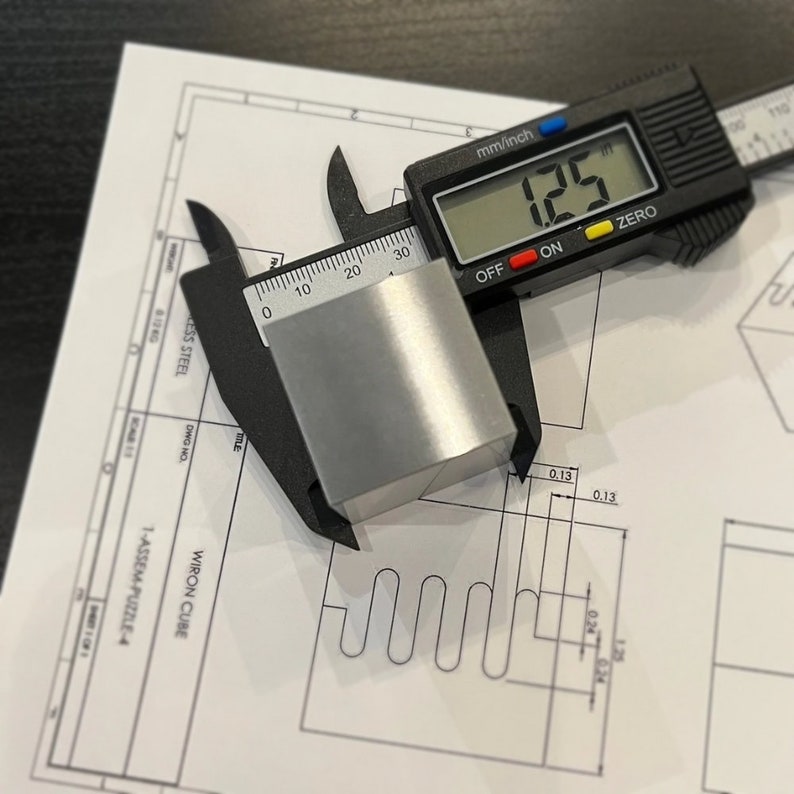 Wiron Cube™ Wire EDM Zigzag Puzzle Pieces. High Precision Fidget Desk