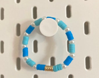 Ocean blue clay bead bracelet with gold and pearl charms