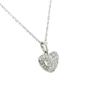 May include: A silver necklace featuring a heart-shaped pendant. The pendant is adorned with numerous small, clear gemstones, giving a sparkling appearance. The chain is fine and delicate, enhancing the pendant's design. The necklace is set against a white backdrop.