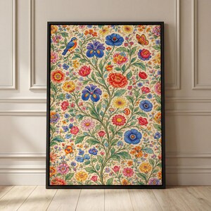 May include: A framed floral print featuring a vibrant botanical design. The artwork showcases a profusion of colorful flowers, including red, blue, and yellow blooms, along with a blue bird and a butterfly. The print is set against a cream-colored background.