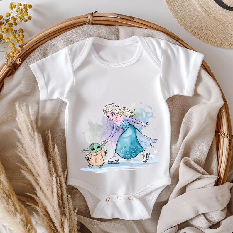 May include: White baby onesie with a watercolor illustration of Elsa from Frozen ice skating with a green Baby Yoda character.