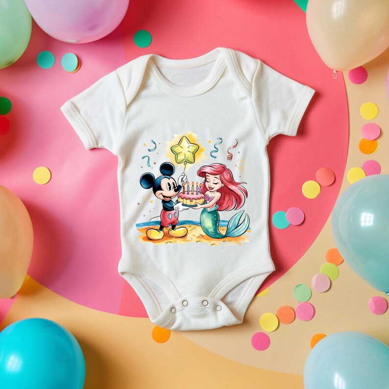 May include: White baby onesie with a colorful illustration of Mickey Mouse and Ariel the Mermaid celebrating a birthday with a cake and a star-shaped balloon.