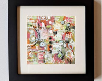 May include: Abstract art print in a black frame. The artwork features a colorful mix of shapes and lines in pink, orange, green, and white. The painting has a textured appearance, with a white mat surrounding the art.