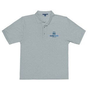 May include: A light gray polo shirt with a blue and white logo that says "outer limit computers".