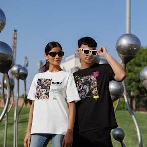 May include: Two people wearing graphic t-shirts with a collage of faces and the text "Know Yourself" and "Hustle" on them. The person on the left is wearing a white t-shirt and the person on the right is wearing a black t-shirt.