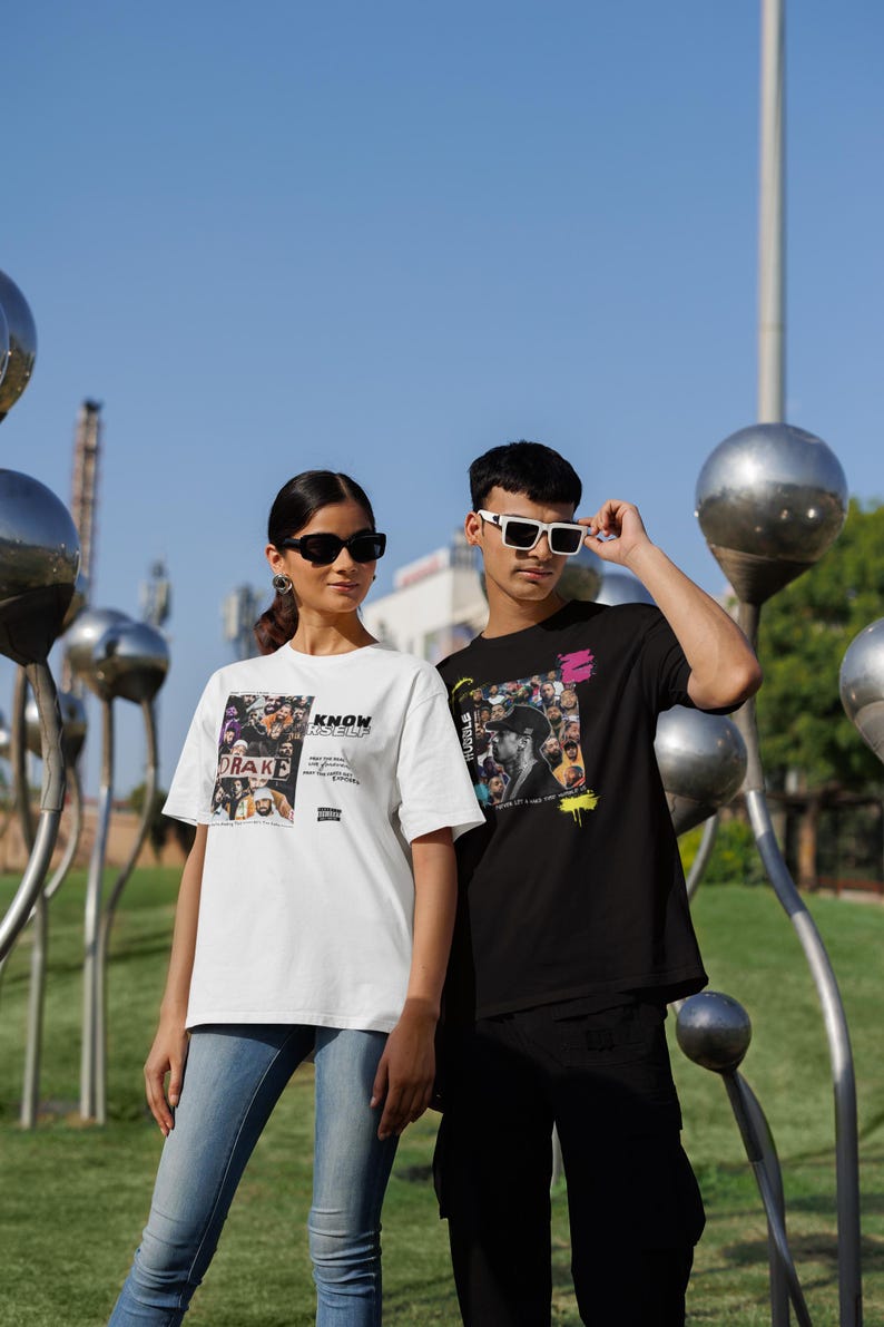 May include: Two people wearing graphic t-shirts with a collage of faces and the text "Know Yourself" and "Hustle" on them. The person on the left is wearing a white t-shirt and the person on the right is wearing a black t-shirt.