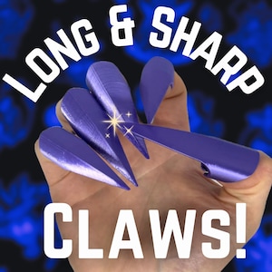 May include: Long and sharp purple claws with a sparkly effect. The text "LONG & SHARP CLAWS!" is written below the claws.