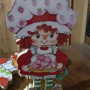Strawberry Shortcake holding cookies wooden hand cut plaque hanger vintage style ready to display gift or party prop themed collection