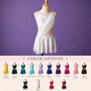 May include: A white two-piece dance outfit featuring a sleeveless crop top and a matching skirt with an attached draped fabric panel. The set is displayed on a mannequin, with a color chart below showing fifteen additional color variations.