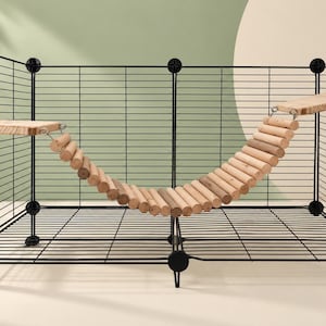 May include: A black wire pet enclosure featuring a suspended wooden bridge made of cylindrical logs. The bridge connects two flat wooden platforms attached to the interior wire walls with metal hardware and circular fasteners.