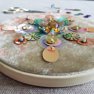 Beads and Sequins Embroidery Design on Beige Velvet.