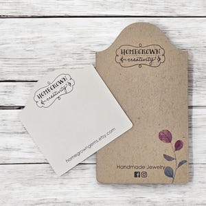 May include: Two brown card stock tags with the text "Homegrown & creativity" and the website address "homegrowngeme.etsy.com". The tag on the right also has the text "Handmade Jewelry" and social media icons for Facebook and Instagram.
