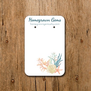 May include: White tag with the text "Homegrown Gems" and the website address "homegrowngegems.etsy.com". The tag features a colorful illustration of coral, seaweed, and a seashell.