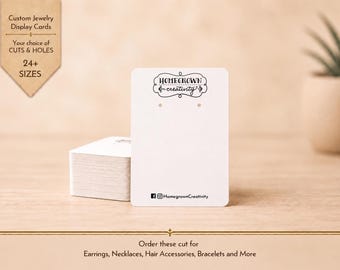 May include: A stack of rectangular white jewelry display cards featuring the black text Homegrown creativity at the top, two small holes for earrings, and social media icons with the handle HomegrownCreativity printed at the bottom edge.