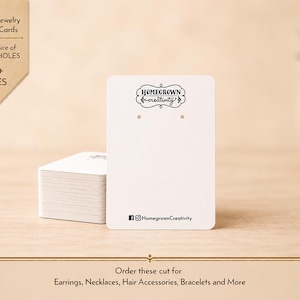 May include: A stack of rectangular white jewelry display cards. The top card features the black text Homegrown creativity in a decorative frame, two small holes for earrings, and the social media handle HomegrownCreativity at the bottom.