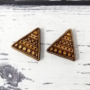May include: A pair of wooden triangle earrings with a geometric pattern in brown and beige.