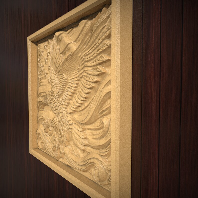 May include: A carved wooden eagle sculpture in a gold frame. The eagle is depicted with its wings spread wide, and its head turned to the side. The sculpture is set against a dark wood background.