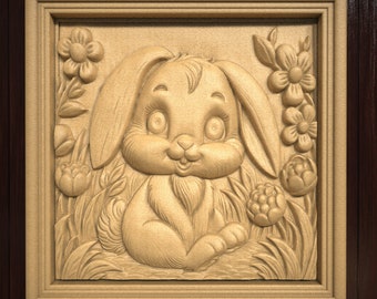 May include: A carved wooden picture frame with a detailed image of a brown bunny rabbit with large eyes and a sweet expression. The bunny is surrounded by carved flowers and leaves.