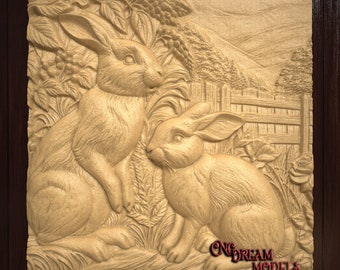 May include: A wooden carving of two rabbits sitting in a field of grass. The rabbits are carved in a realistic style and have detailed fur. The carving is set against a background of a wooden fence and a distant mountain range. The carving is signed "CNC DREAM MODELS".