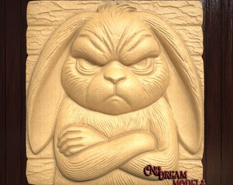 May include: A wooden carving of a rabbit with a grumpy expression. The rabbit has its arms crossed and is looking directly at the viewer. The carving is on a wooden background.