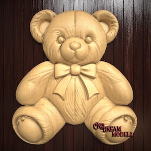 May include: A wooden carving of a teddy bear with a bow tie. The bear is sitting with its legs crossed and has a friendly expression.