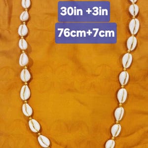 Handmade Cowrie Shell Necklace:  African Inspired Brass Jewelry, Ajustable with a stainless steel chain