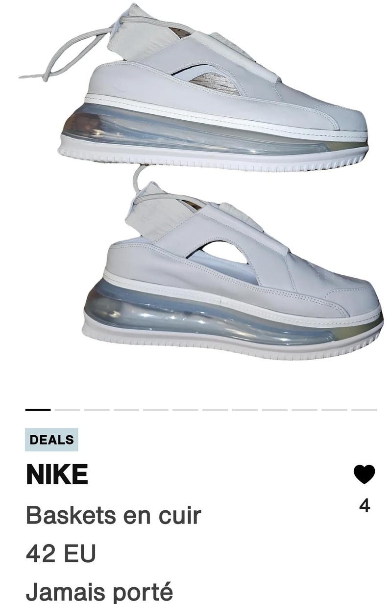 May include: Pair of white leather trainers with a distinctive design. The shoes feature a transparent, bubble-like sole and a strap detail. The trainers are a modern style, suitable for casual wear.