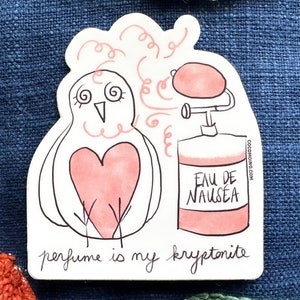 May include: A sticker featuring a whimsical illustration of a bird with a pink heart and dizzy eyes, next to a perfume bottle labeled "Eau de Nausea." The text "perfume is my kryptonite" is written below the bird.