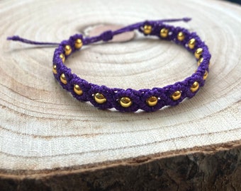 purple makramee bracelet with golden beads
