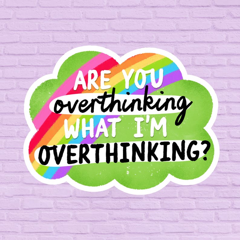 May include: A sticker with a green cloud shape, a rainbow, and the text "ARE YOU overthinking WHAT I'M OVERTHINKING?" in white and black. The sticker is on a light purple brick wall.