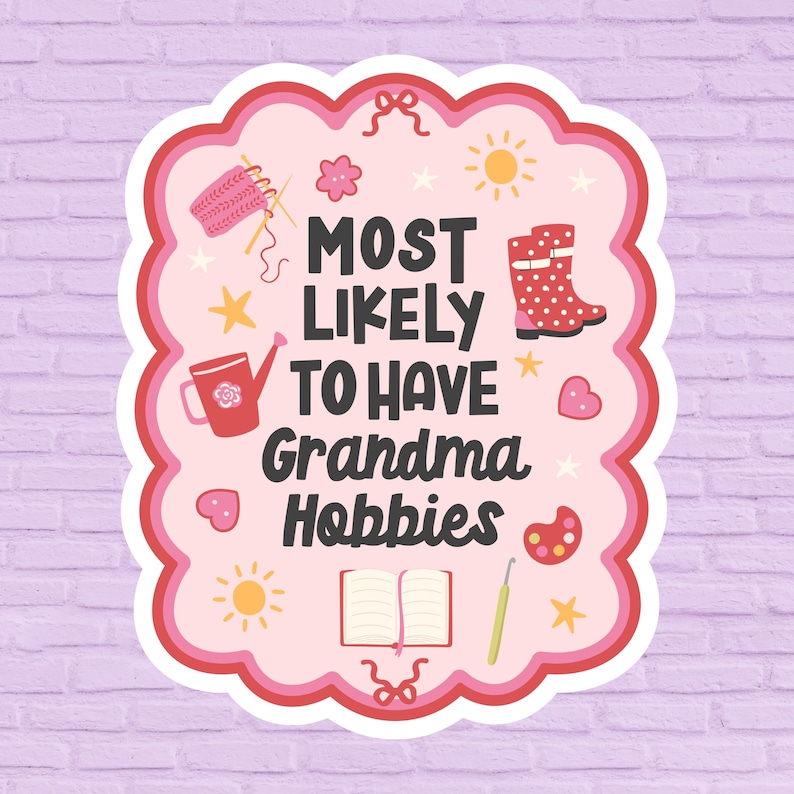 May include: A sticker with a pink and red scalloped border, featuring the text "MOST LIKELY TO HAVE Grandma Hobbies." The design includes illustrations of knitting needles, a watering can, a boot, and other craft-related icons.