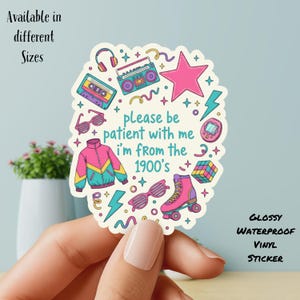 May include: A glossy, waterproof vinyl sticker with a cream background and colorful 1980s-themed graphics. The sticker features a boombox, cassette tape, roller skate, sunglasses, and the text "please be patient with me I'm from the 1900's."