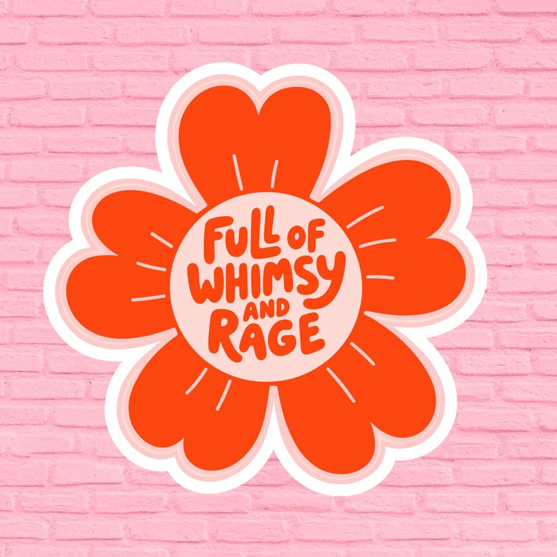 May include: A sticker featuring a stylized orange flower with a white border. The flower's center contains the text "Full of Whimsy and Rage" in a playful font. The background is a pink brick wall.