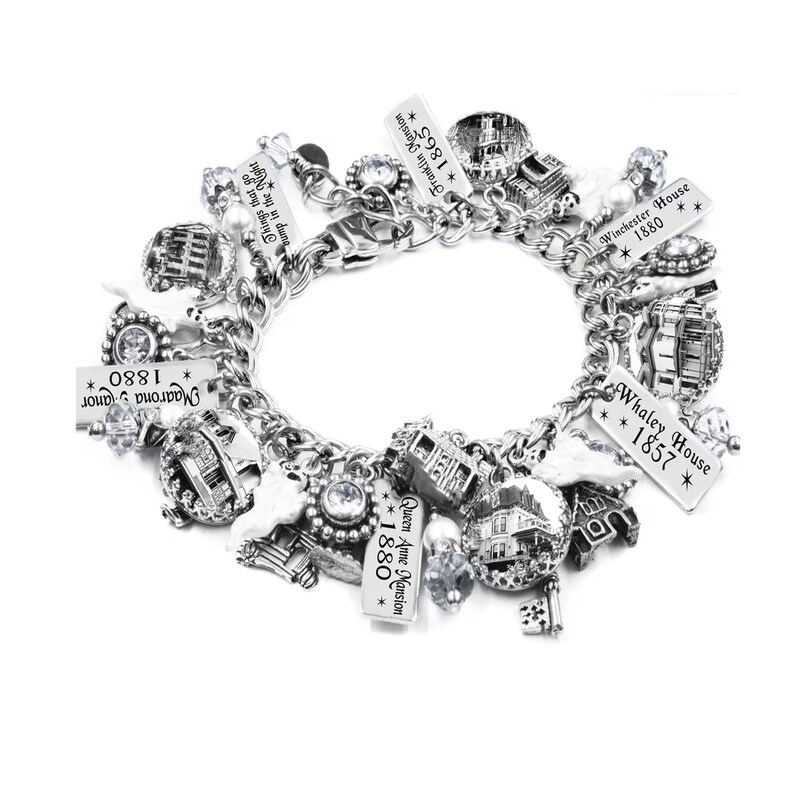 Haunted house charm bracelet with vintage mansion photo charms, ghost charms, engraved tags, pearl ghosts, crystals, and Halloween accents.