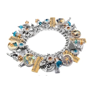 A silver-toned charm bracelet adorned with various Egyptian-themed charms, including a pharaoh, hieroglyphics, and other Egyptian symbols.