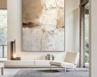 May include: Large abstract painting with a neutral color palette. The artwork features textured brushstrokes in shades of beige, brown, and white, creating a layered effect. The painting is framed and displayed in a modern living space.