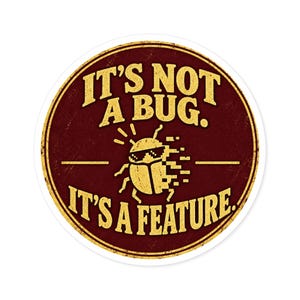 May include: A circular sticker with a dark red background and a distressed yellow border. The text reads IT'S NOT A BUG. IT'S A FEATURE. in yellow capital letters. A yellow pixelated beetle wearing sunglasses is centered.